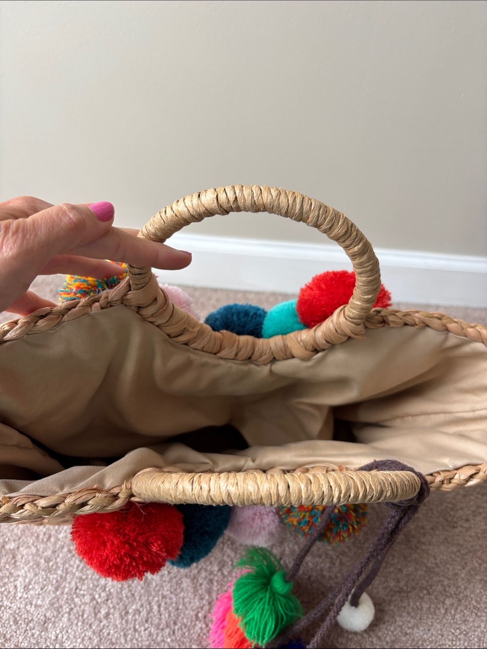 Straw Tote with Multicolor Pom-Pom Accents and pull string closure. - Picture 3 of 4